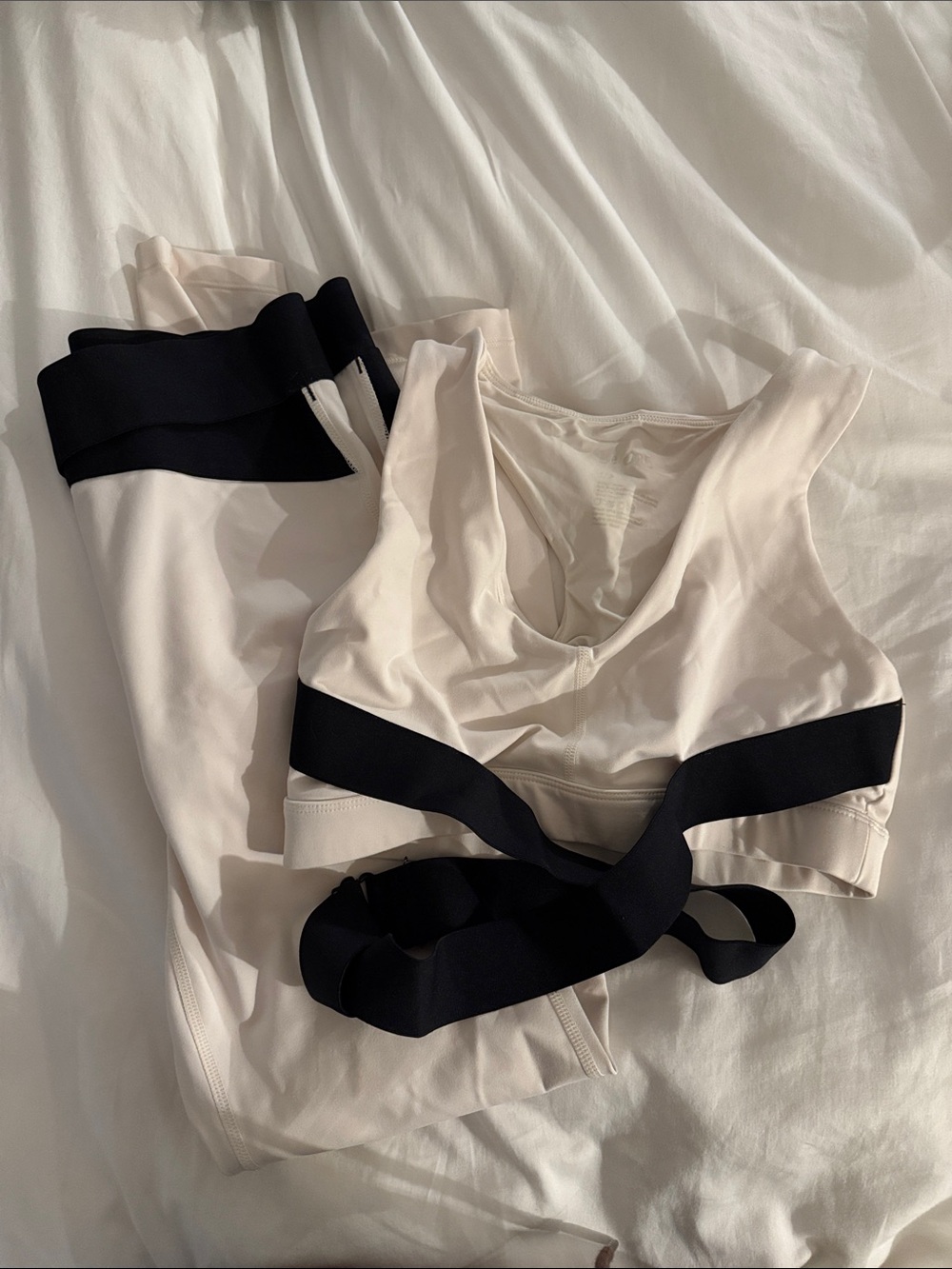 Like new Le Ore Cream and Black Wrapped Sports Bra & Leggings Set